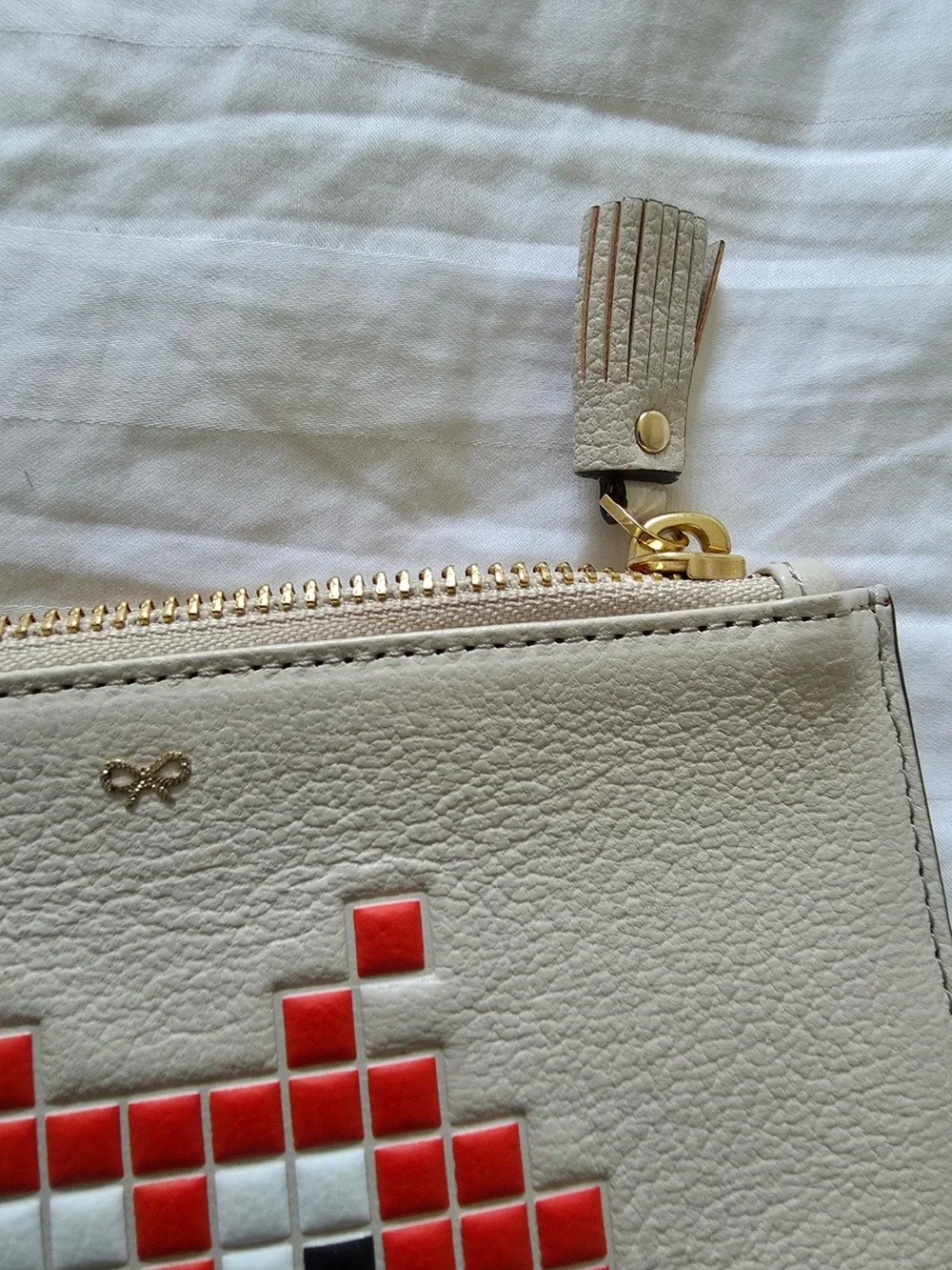 Anya Hindmarch Cream Leather Wristlet Clutch with Red Pixel Alien Motif